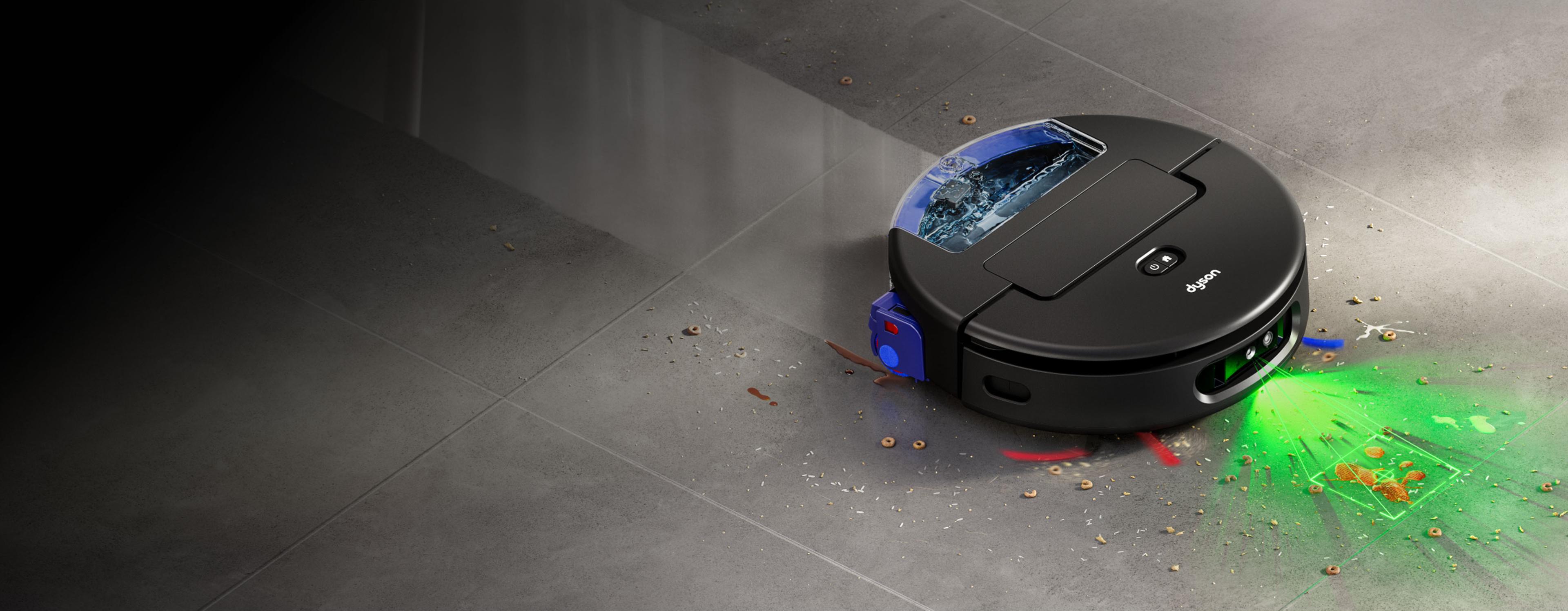 Dyson Spot+Scrub Ai освещает пол зелёным лучом, помогая обнаруживать пролитые жидкости и пятна.